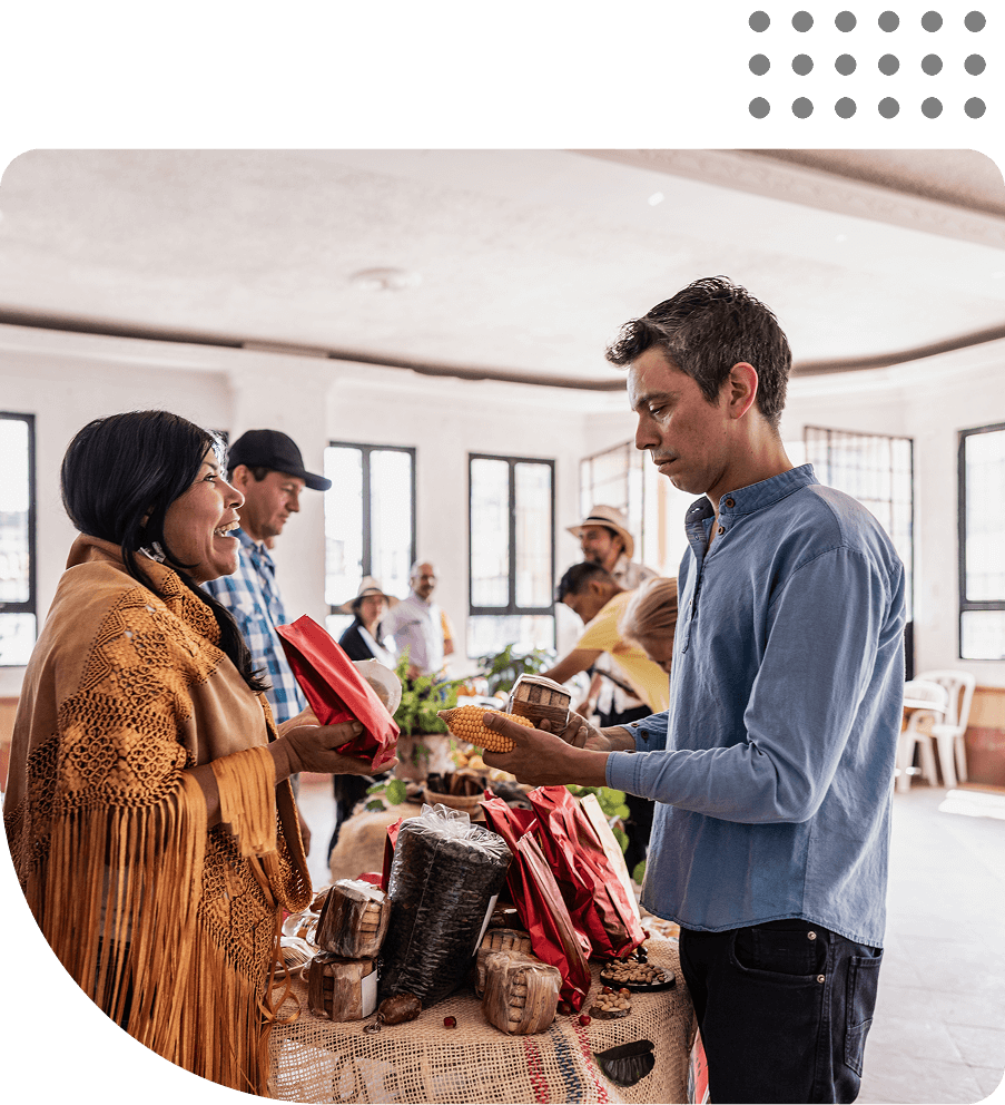 Man and woman exchanging goods at market.